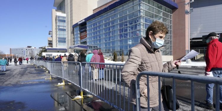 Vaccine drive gains speed, but maskless fans fuel worries