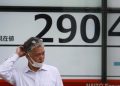 Asian markets lower after Wall Street recovers to new high
