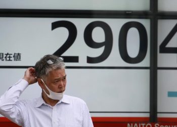 Asian markets lower after Wall Street recovers to new high