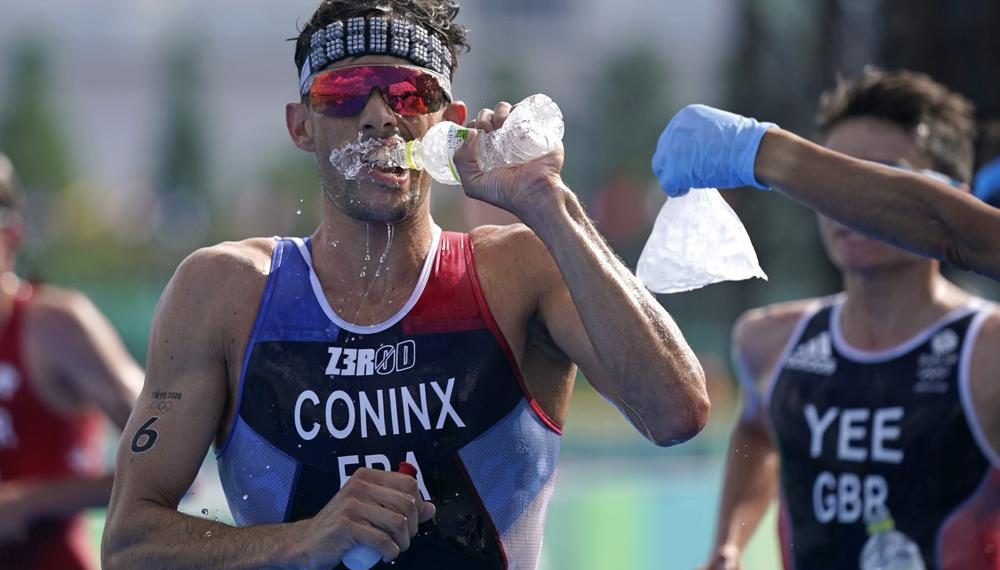 Pandemic Olympics endured heat, and now a typhoon’s en route