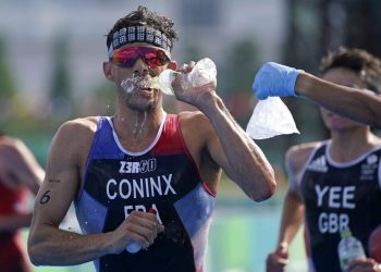 Pandemic Olympics endured heat, and now a typhoon’s en route