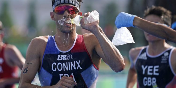 Pandemic Olympics endured heat, and now a typhoon’s en route