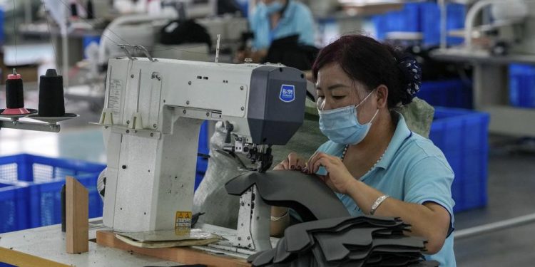 Official: China’s growth likely to slow due to virus, floods