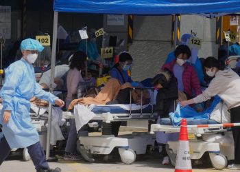 Hong Kong considers lockdown as daily infections top 34,000