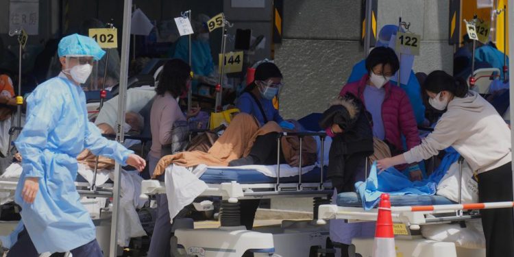Hong Kong considers lockdown as daily infections top 34,000