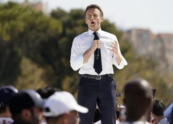Macron courts Marseille voters; climate activists in Paris