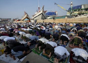 Muslims mark Eid al-Fitr holiday with joy, worry