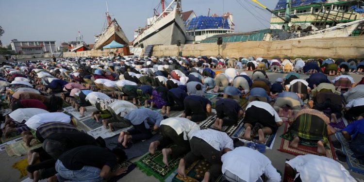 Muslims mark Eid al-Fitr holiday with joy, worry