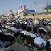 Muslims mark Eid al-Fitr holiday with joy, worry