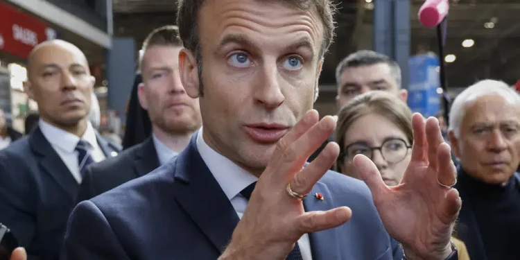 Macron defends contested pension plan at French farm fair