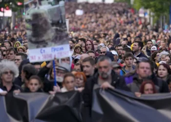 Tens of thousands march against Serbia’s populist leadership following mass shootings