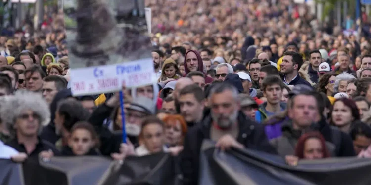 Tens of thousands march against Serbia’s populist leadership following mass shootings