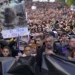 Tens of thousands march against Serbia’s populist leadership following mass shootings