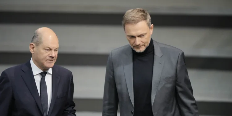 Germany’s leader vows to fix a spending crisis that’s worsening gloom in the struggling economy