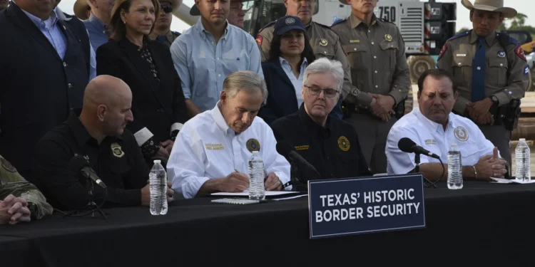 Texas governor signs bill that lets police arrest migrants who enter the US illegally