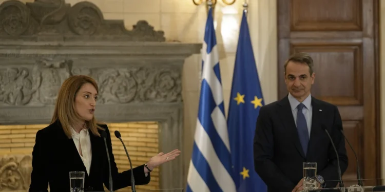 Despite mounting criticism, Greece’s prime minister defends record on rule of law