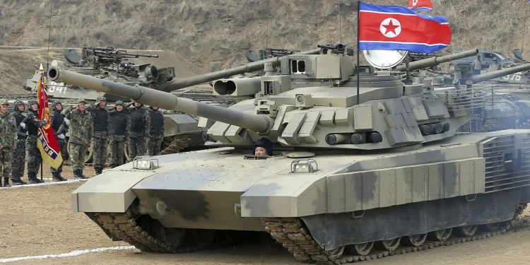 North Korea’s Kim test drives a new tank and orders troops to prepare for war