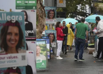 Australians start voting in general elections as pope’s death overshadows campaigning