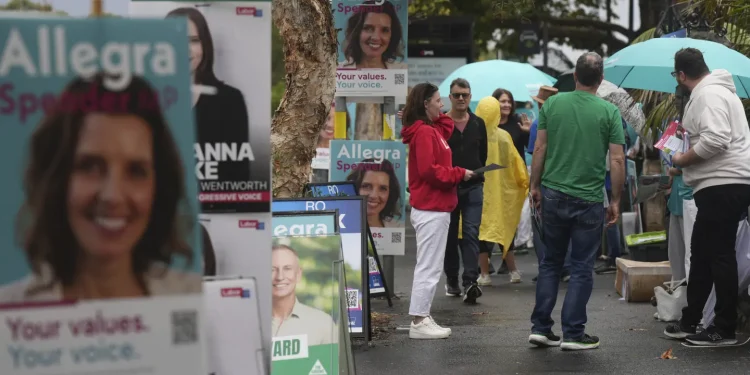 Australians start voting in general elections as pope’s death overshadows campaigning