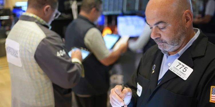 Wall Street holds near its record amid doubts about Trump’s tariffs