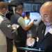 Wall Street holds near its record amid doubts about Trump’s tariffs